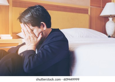 Sad Business Man Sit In Hotel Room