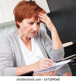 Sad Businesswoman With Document. Elderly Woman Writing A Letter