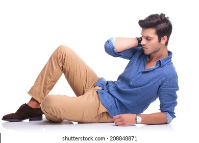 Sad Casual Man Lying Down On White Background