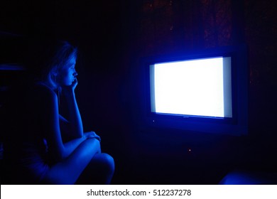 Sad Caucasian Woman Watching Tv At Night