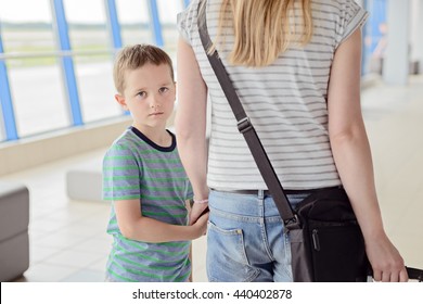 Sad Child, Boy Travelling With His Mother