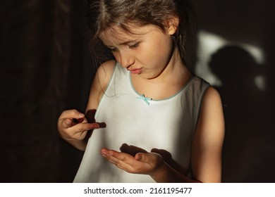 Sad Child Girl With ADHD. Lonely Schoolgirl Has Mental Health Issues And Difficulties With Social Recognition. The Concept Of Social Rejection And Pessimism.