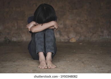 Sad Child Sitting In Old Room, Trafficking In Human Beings