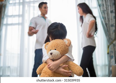 Sad child from this father and mother arguing, family negative concept. - Powered by Shutterstock