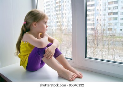 Sad Child At The Window.