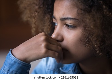 Sad Concerned Black Teenage Girl Thinking Over Problems, Bad News, Going Through Stress, Anxiety, Emotional Trauma, Abuse. Fae Close Up Shot. Psychology, Youth, Adolescence Concept