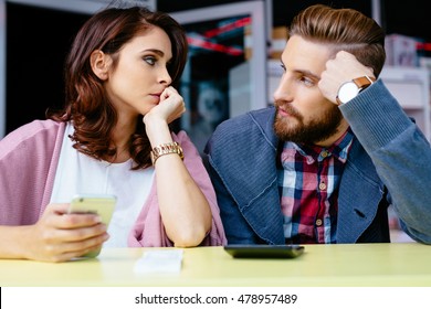 Sad Couple Worried About Home Finances