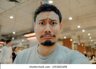 Sad And Crying Face Of Asian Man Who Get Lost In The Mall.