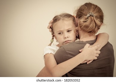 Sad Daughter Hugging His Mother