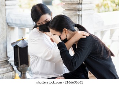 Sad Daughter With Understanding Mother In Religious Service