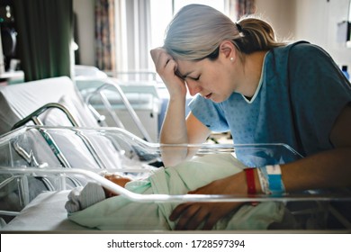 A Sad And Depress Mother With Her Newborn Baby At The Hospital A Day After A Natural Birth Labor