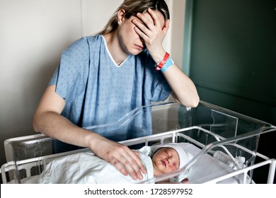 A Sad And Depress Mother With Her Newborn Baby At The Hospital A Day After A Natural Birth Labor