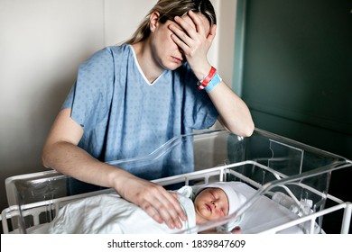 Sad And Depress Mother With Her Newborn Baby At The Hospital A Day After A Natural Birth Labor