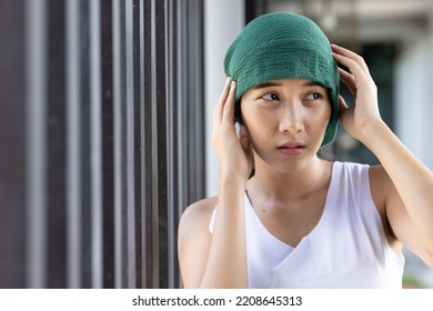 Sad And Depressed Asian Woman Cancer Patient Suffering From Alopecia areata, Local Patchy Hair Loss Negative Side Effect Due To Chemotherapy Or Radiation Therapy Treatment