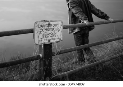 Sad And Depressed Male Looking Over The Edge. 