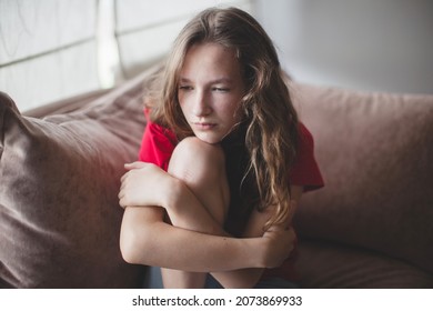 Sad Depressed Woman Feeling Bad Down On Couch At Home. Hopeless Alone, Upset Teen Female Victim In Trouble Being Heartbroken Offended Abused, Having Problem Addiction, Girl In Despair Concept