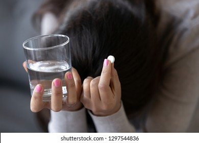 Sad Depressed Woman Or Teen In Depression Holding Pill And Glass Of Water Desperate Troubled With Pregnancy Taking Abortion Meds Drugs Worried About Side Effects Of Antidepressant Emergency Medicine