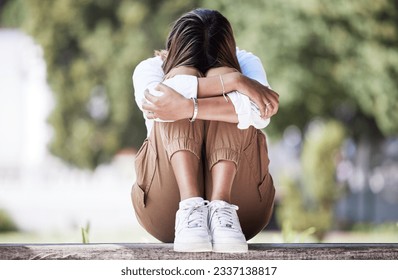 Sad, depression and student with woman in park for cry, frustrated and stress. Mental health, anxiety and fear with female person in nature for psychology, tired and fatigue with mockup space - Shutterstock ID 2337138817