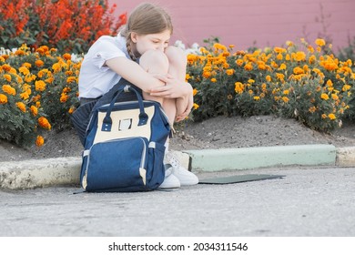 Sad Desperate Young Girl Suffering From Bulling And Harassment Felling Lonely, Unhappy Desperate And Hopeless Sitting Outdoors. School Isolation, Abuse And Bullying Concept