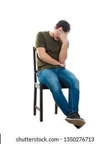 Sad And Disappointed Man Sitting On A Chair Covering His Face With Hand, Full Length Isolated Over White Background. Desperate Casual Guy Having Anxiety, Distress Depression Feeling, Seated Alone.