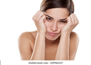 Sad And Disappointed Young Woman On A White Background