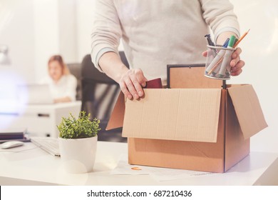 Sad dismissed worker taking his office supplies with him - Shutterstock ID 687210436