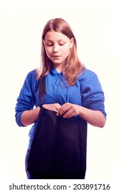 Sad Dissapointed Teen Girl Looking For Something In A Bag