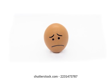 A sad egg on White background