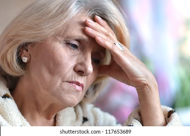 Sad Elderly Woman Sitting In A Room