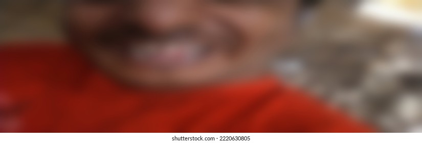 A Sad Emaciated Young Man Cries From Hunger. Blurred Image 