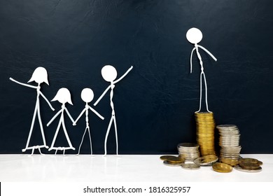 Sad And Envious Stick Man Figure On Top Of Pile Of Coins Beside A Happy Family. Genuine And True Happiness In Life, Contentment And Fullfillment, Family Versus Money Or Career Concept.