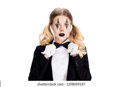 Sad Female Clown Standing In Suit And Touching Bow Tie Isolated On White 