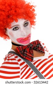 Sad Female Clown  With Suspenders.  Studio, White Background