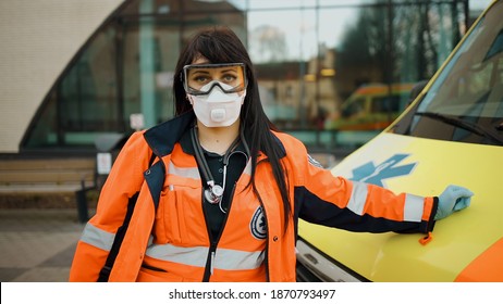 Sad Female Paramedic Stares At You. Writing On Clothes Means Urgent Care