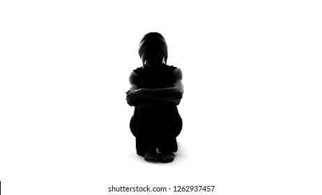 Sad female shadow sitting floor with crossed arms, domestic violence depression