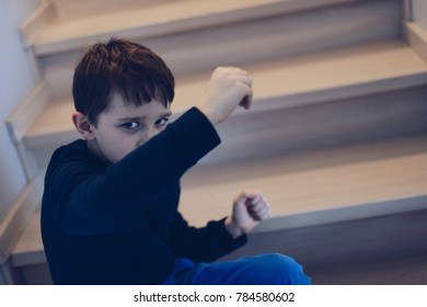 Sad Frightened Child Covering His Face From Hit. Domestic Violence