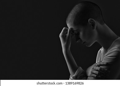 Sad, Frightened And Depressed Female Cancer Patient Portrait On Dark Background With Copy Space. Breast Cancer Patient, Head In Hands, Black And White Portrait.