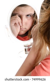 A Sad Girl Is Crying While Looking At The Viewer In A Mirror, Isolated Against A White Background.