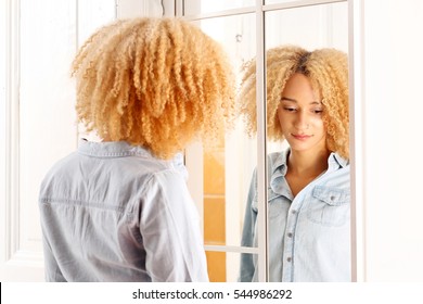 Sad Girl Looks At Himself In The Mirror