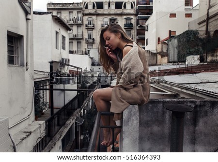 Similar – Woman looking from her balcony the city