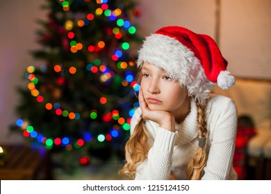 Sad Girl Near Christmas Tree Looking Away