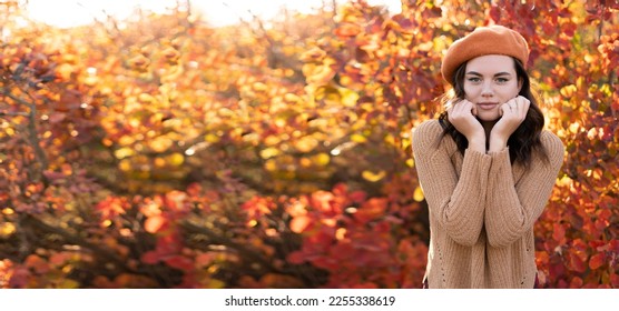 Sad girl over autumn leaves background. Copy space. Banner - Shutterstock ID 2255338619
