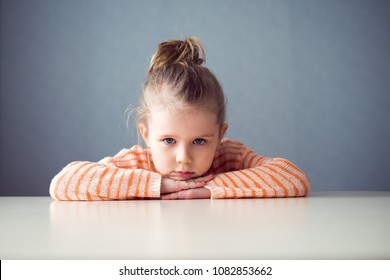 Sad Girl Preschooler At The Table