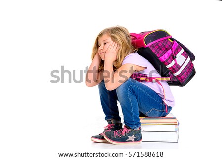 sad girl with schoolbag on first day at school
