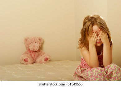 Sad Girl Sitting On Old Mattress