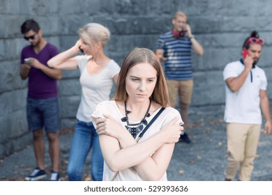 Sad Girl Standing Among People Using Stock Photo 529393636 | Shutterstock