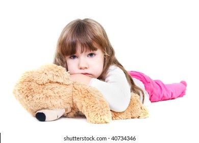 Sad Girl With Teddy Bear Over White