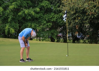 a sad golfer that missed his putt