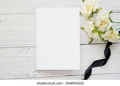 Sad Grief Card Mockup, Funeral Program Template On Washed Wood Background, Sympathy, Condolence Card, White Flowers With Black Ribbon.
