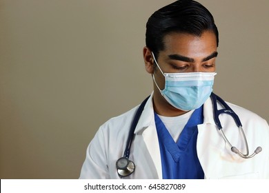 Sad Handsome Doctor Looking Down Wearing Face Mask 